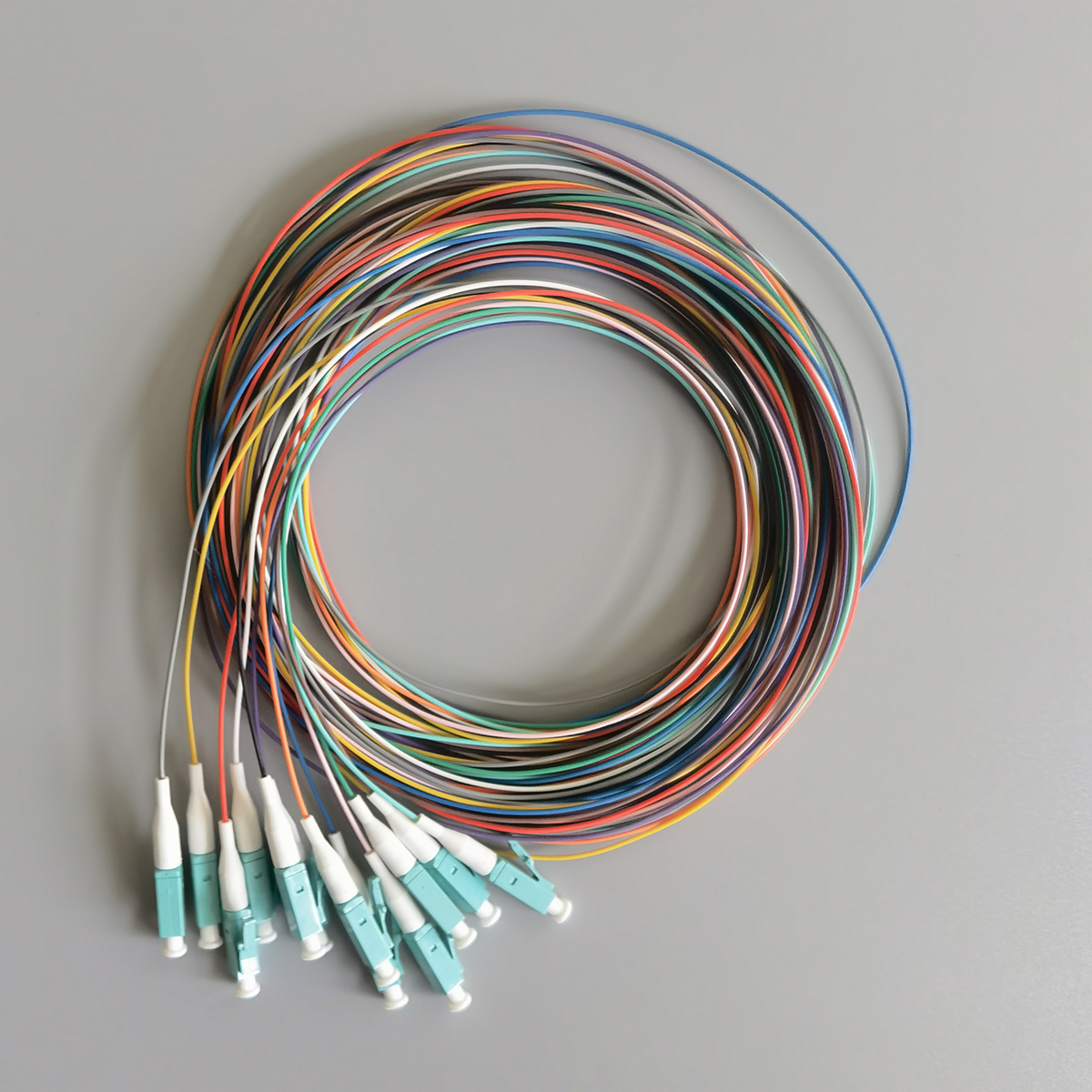 FTTH OM3 LC Aqua Multimode Fiber Optic Pigtail Cable 0.9mm LSZH for Telecom and Data Center