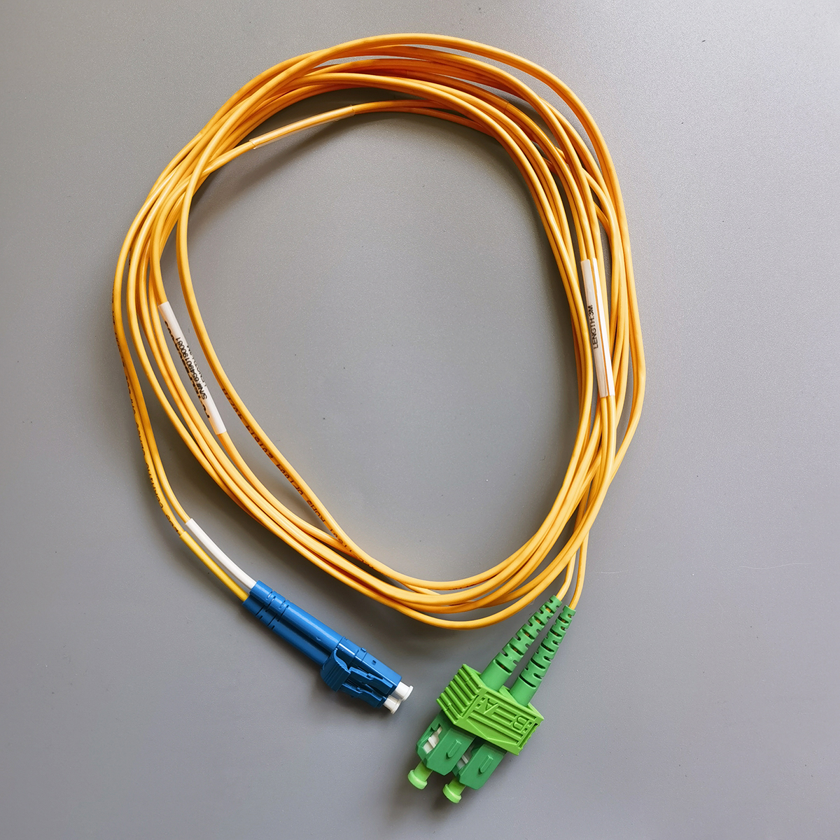 FTTH LC UPC to SC APC Duplex Fiber Optic Patch Cord 2.0mm Single Mode Optical Cable 